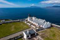 overhead shot of Clare Island Lighthouse with the Atlantic Ocean in the background