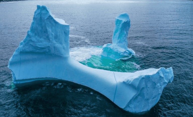 Photographer takes photo of phallic-shaped iceberg near town called Dildo