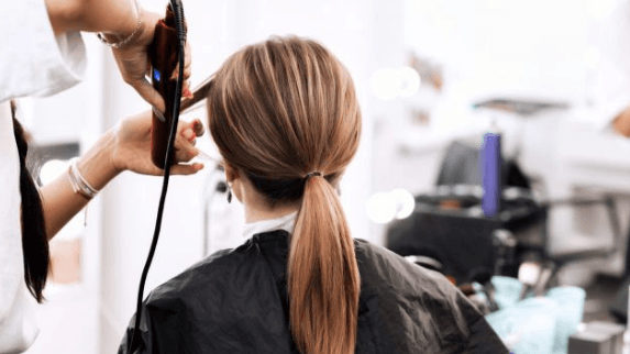 The government is considering reopening hairdressers three weeks earlier than planned