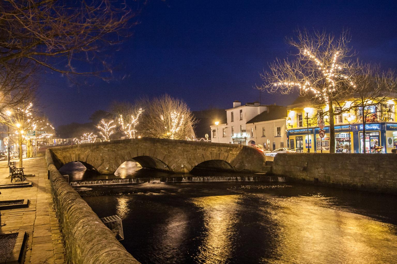 Nearly 100 towns have joined a campaign to lift spirits by leaving Christmas street lights on