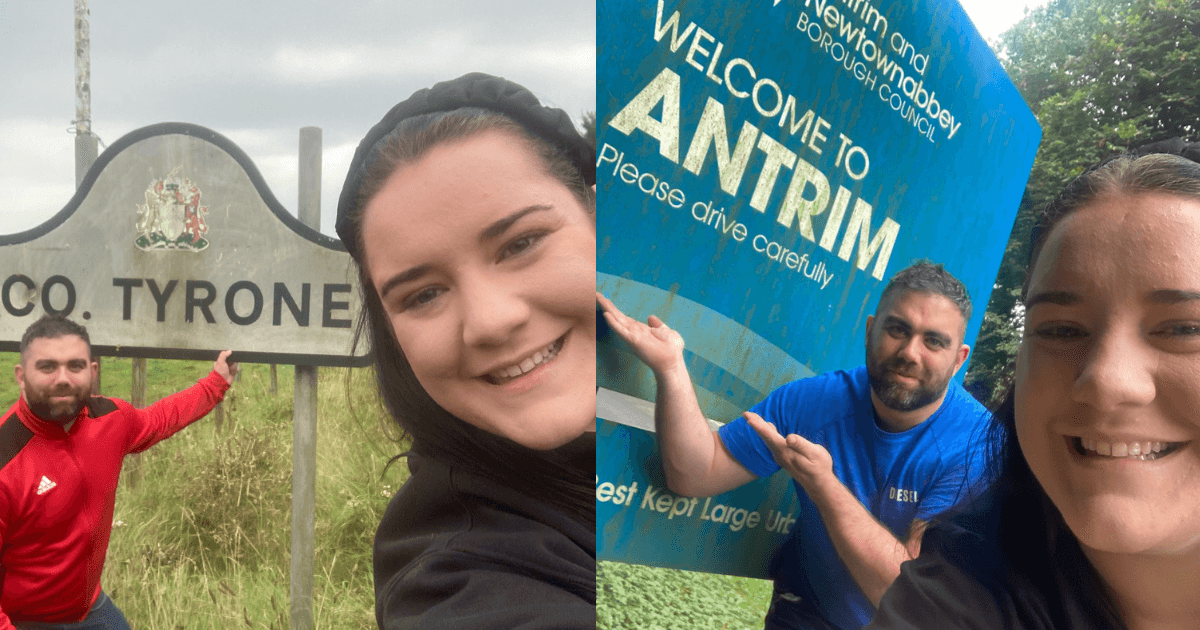 Irish couple take a photo beside all 32 county signs in Ireland