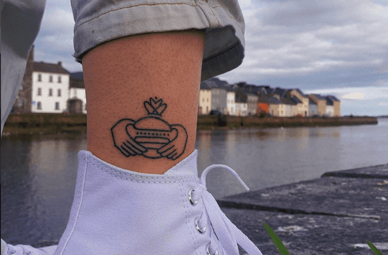 Handsome Burger will give the first person to get their logo tattooed free burgers for life Handsome Burger will give the first person to get their logo tattooed free burgers for life