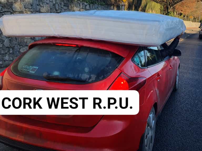 Cork car pulled over for travelling with mattress ‘secured’ to roof by driver’s right hand Cork car pulled over for travelling with mattress ‘secured’ to roof by driver’s right hand