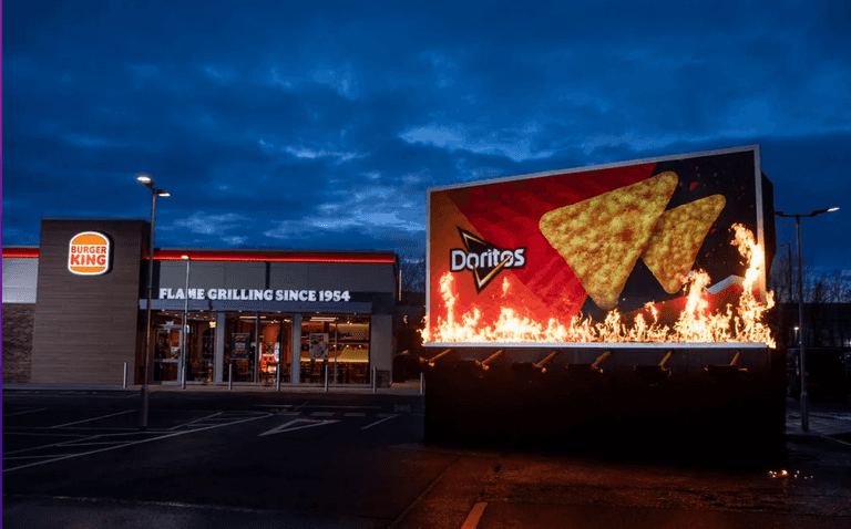 Billboard goes up in flames outside UK Burger King to promote new collaboration Billboard goes up in flames outside UK Burger King to promote new collaboration